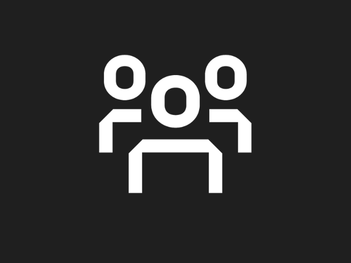 Black background with white icon showing three head and shoulders outlines to demonstrate a group of people